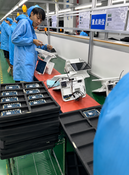 Assembly line for biometric kiosk display and camera integration