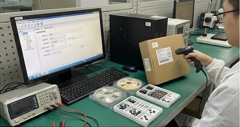 AQL sampling station with barcode scanner and MES screen showing lot traceability